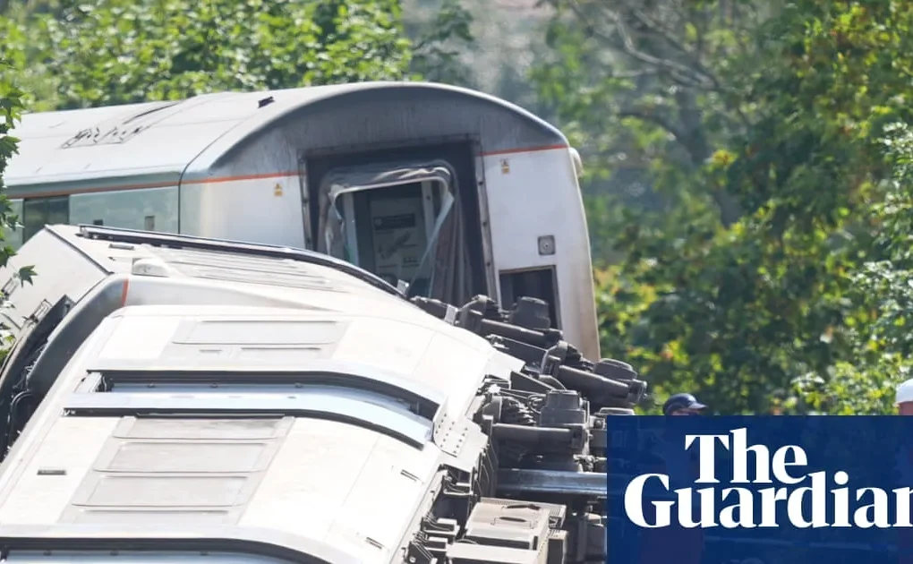 Emergency crews at a derailed train near Lewes with investigators examining the track