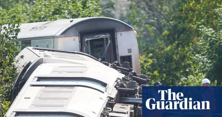 Emergency crews at a derailed train near Lewes with investigators examining the track