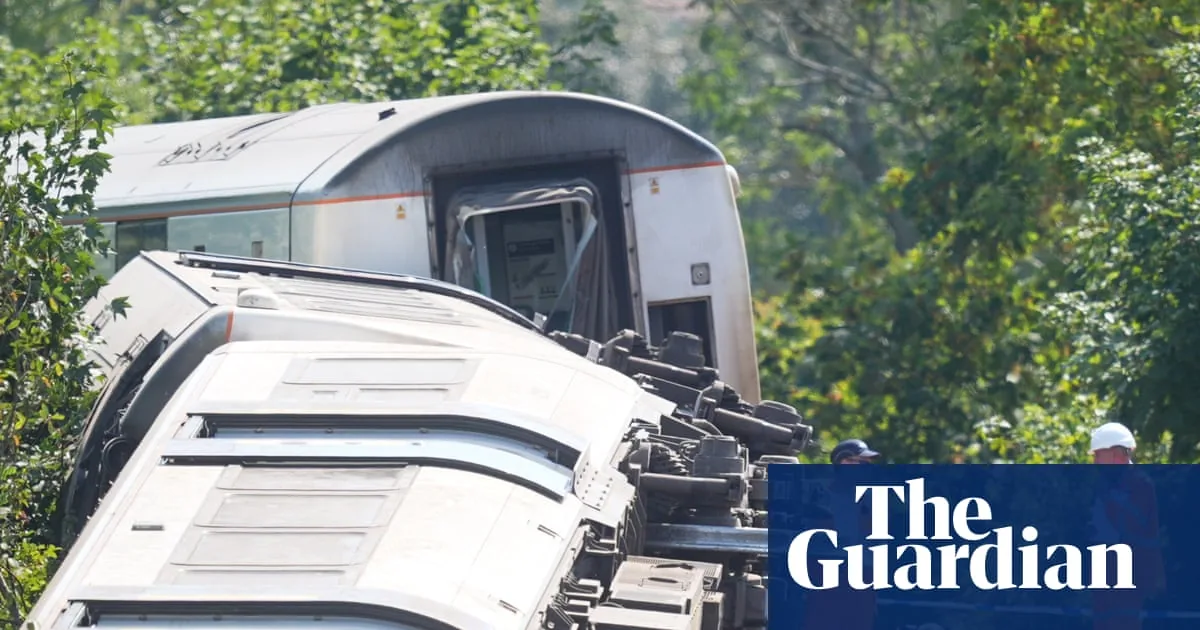 Emergency crews at a derailed train near Lewes with investigators examining the track
