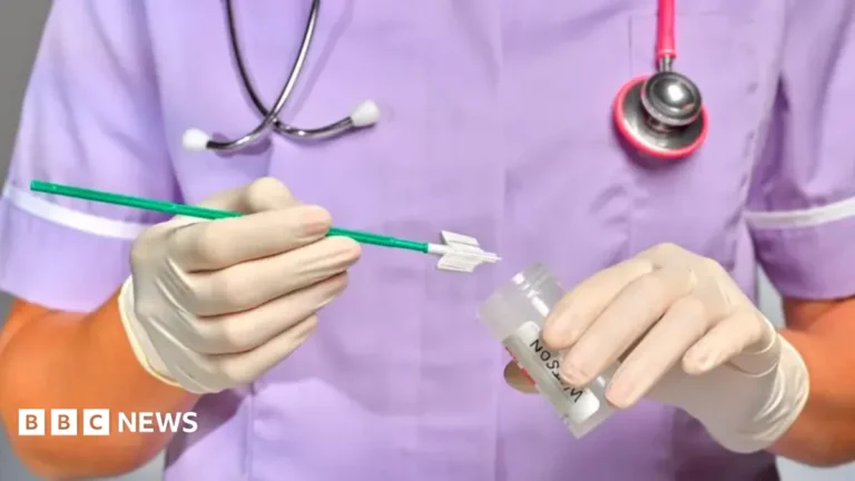A woman holding a home HPV self-testing kit for cervical screening