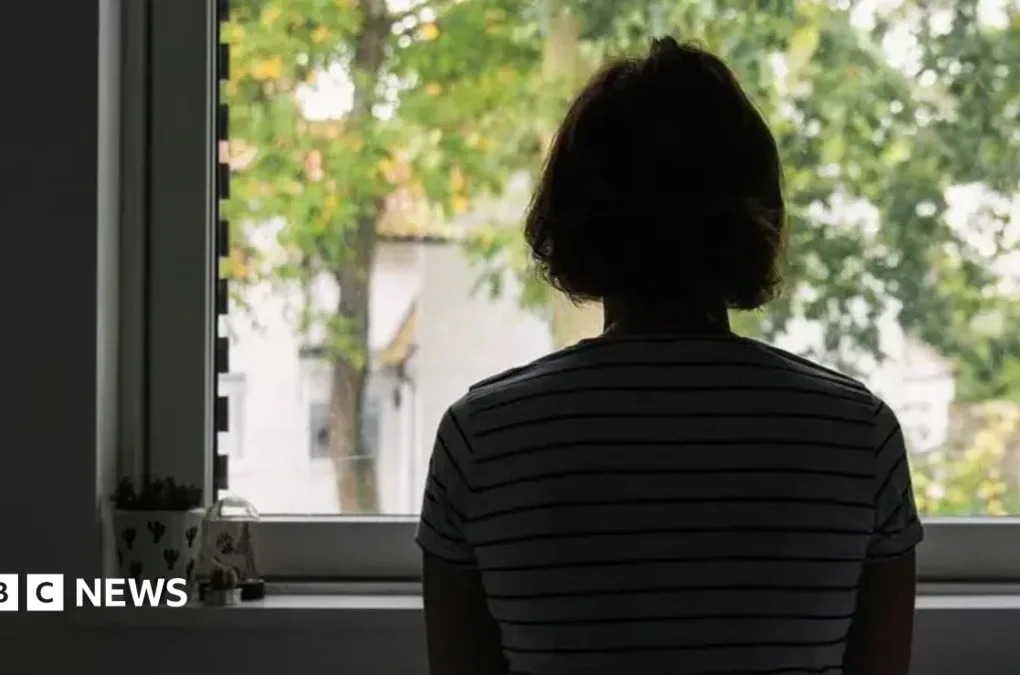 A psychiatrist speaking with a patient during a mental health appointment