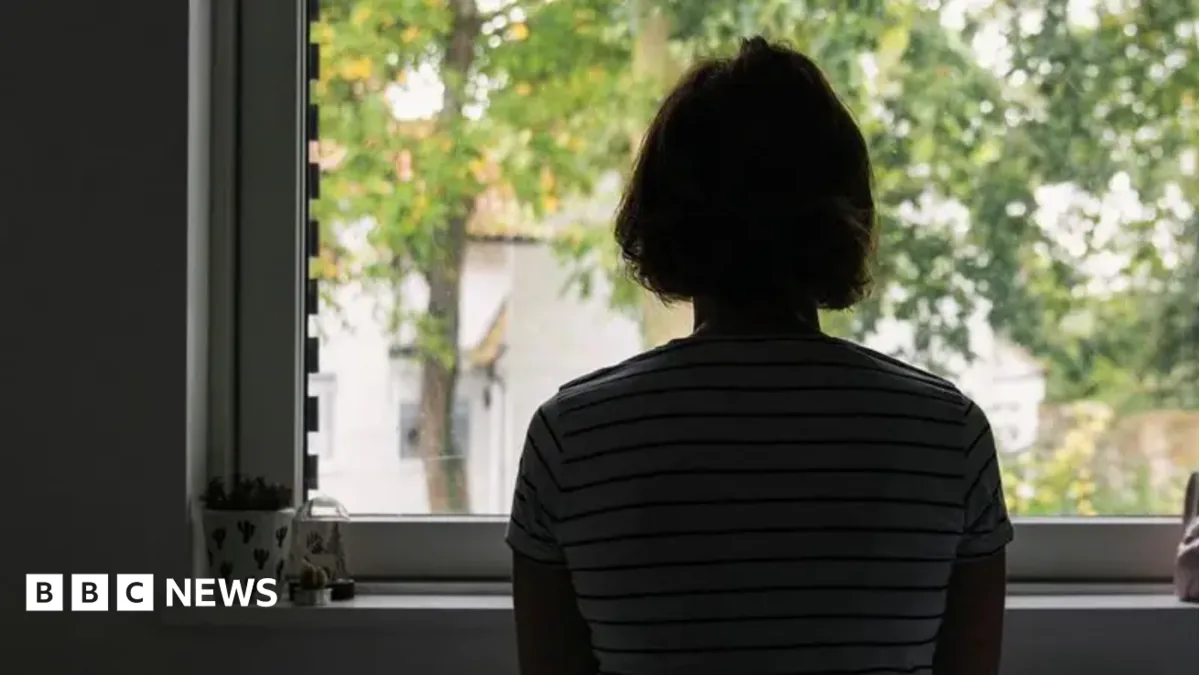 A psychiatrist speaking with a patient during a mental health appointment