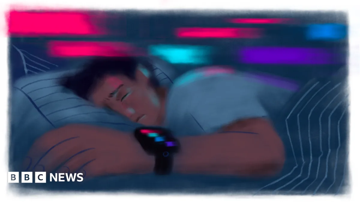 Person checking a sleep tracker score on a wrist-worn device