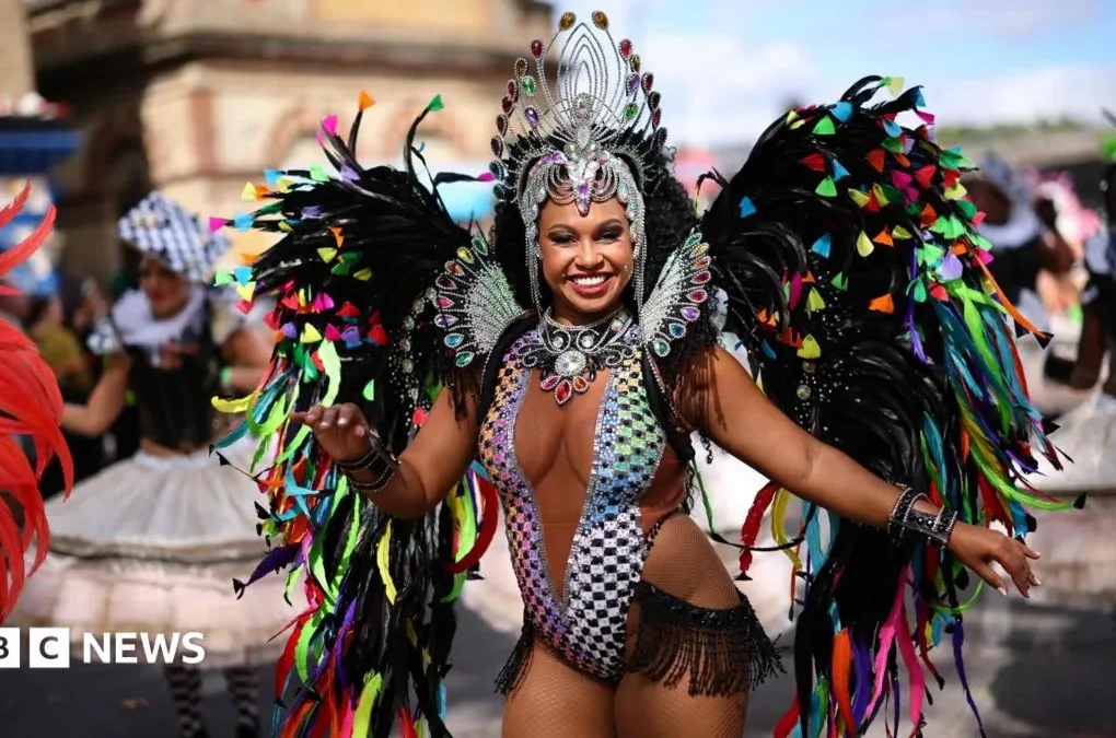 Dancers and drummers performing at Notting Hill Carnival in west London
