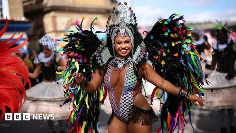 Dancers and drummers performing at Notting Hill Carnival in west London