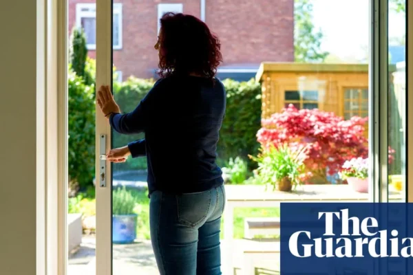 A locksmith fitting a door lock as hot weather causes doors to jam and misalign