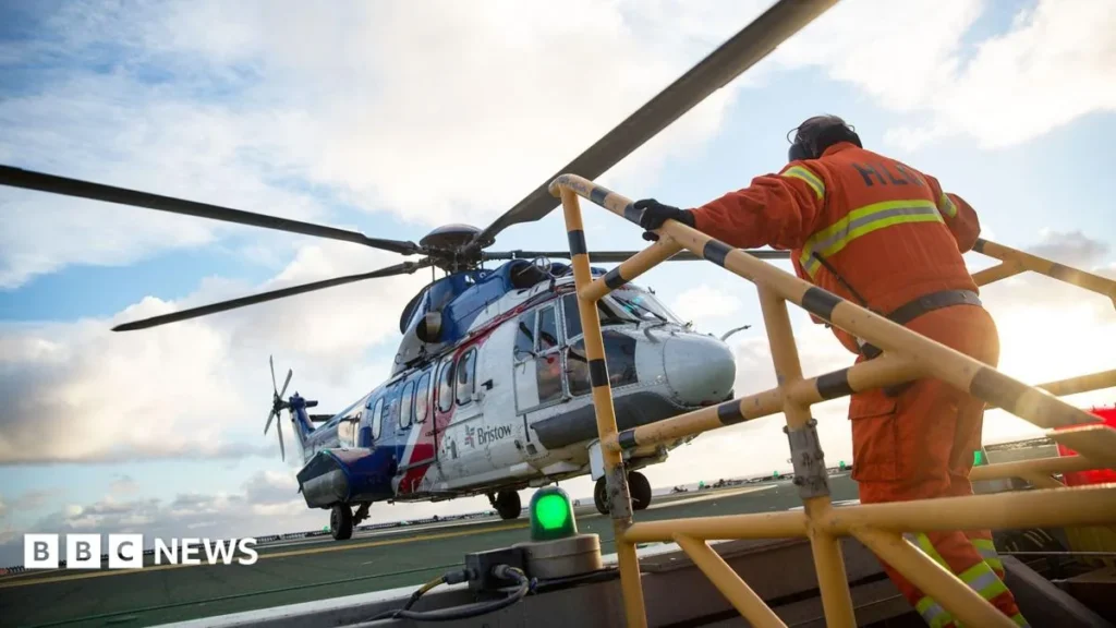 Offshore workers boarding a helicopter for travel to North Sea installations